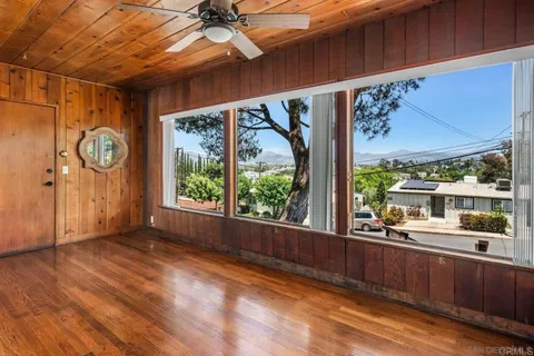 a view of a porch with wooden floor