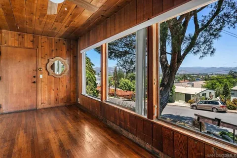 a view of a porch with wooden floor and outer view
