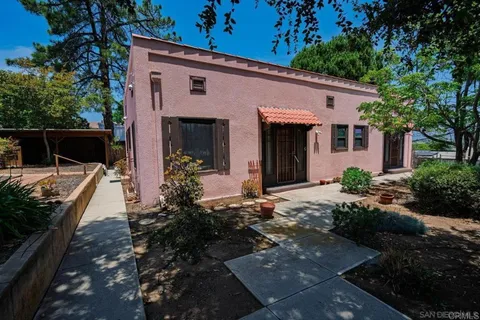 a view of a house with patio outdoor seating