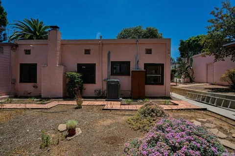 a front view of a house with yard