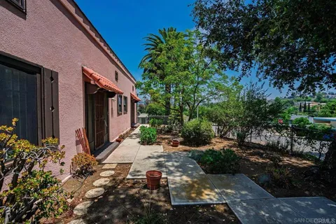 a backyard of a house with a garden