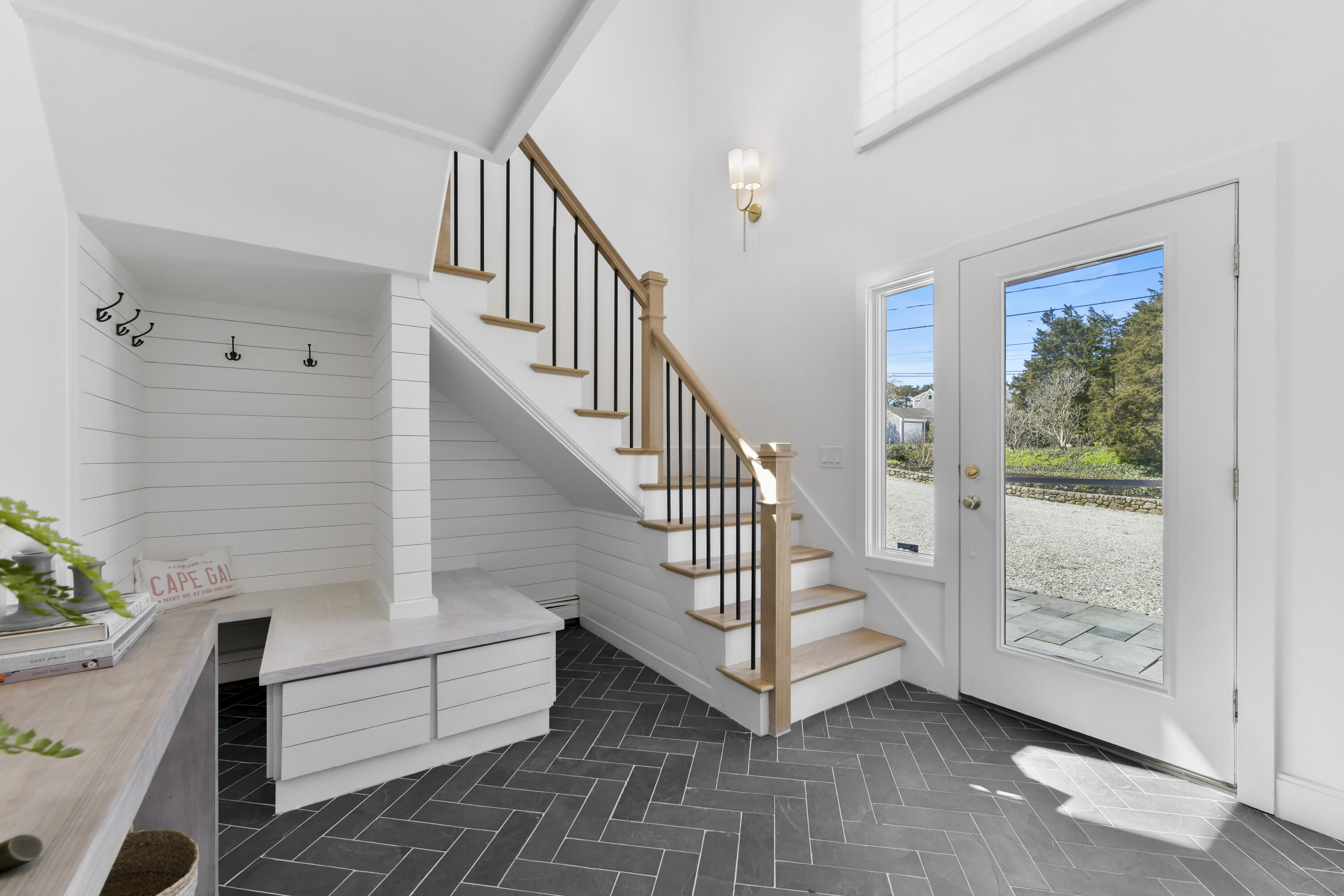 3 Harbor Road Orleans, MA 02653 - Photo 30 of 36 a view of entryway with wooden floor and stairs