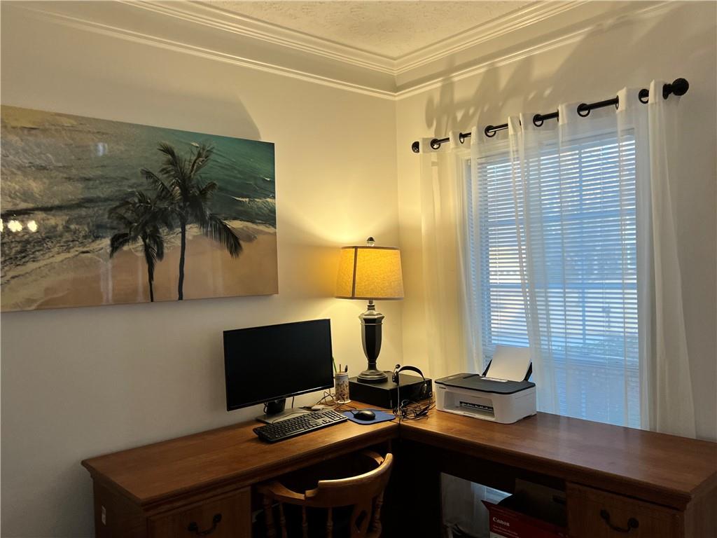 5415 Taylor Road Alpharetta, GA 30022 - Photo 14 of 29 a view of a workspace with furniture and wooden floor