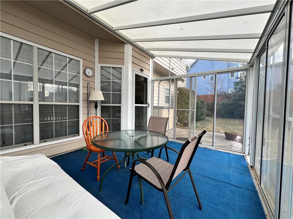 5415 Taylor Road Alpharetta, GA 30022 - Photo 22 of 29 a living room with furniture and a window