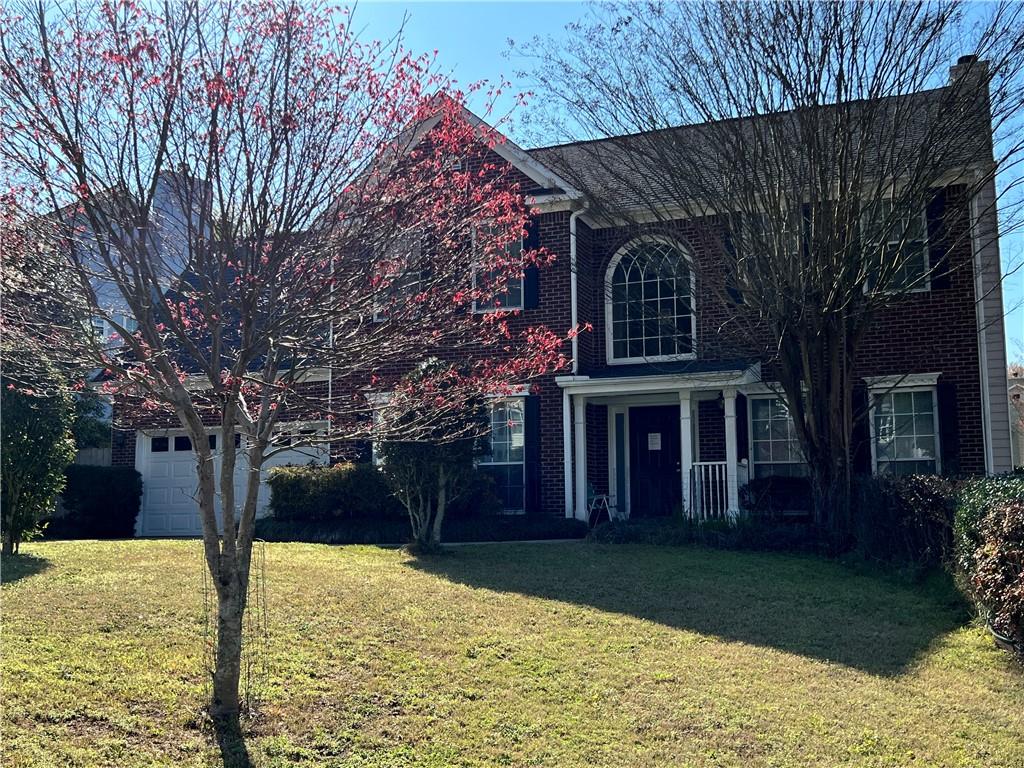 5415 Taylor Road Alpharetta, GA 30022 - Photo 26 of 29 front view of house with a yard