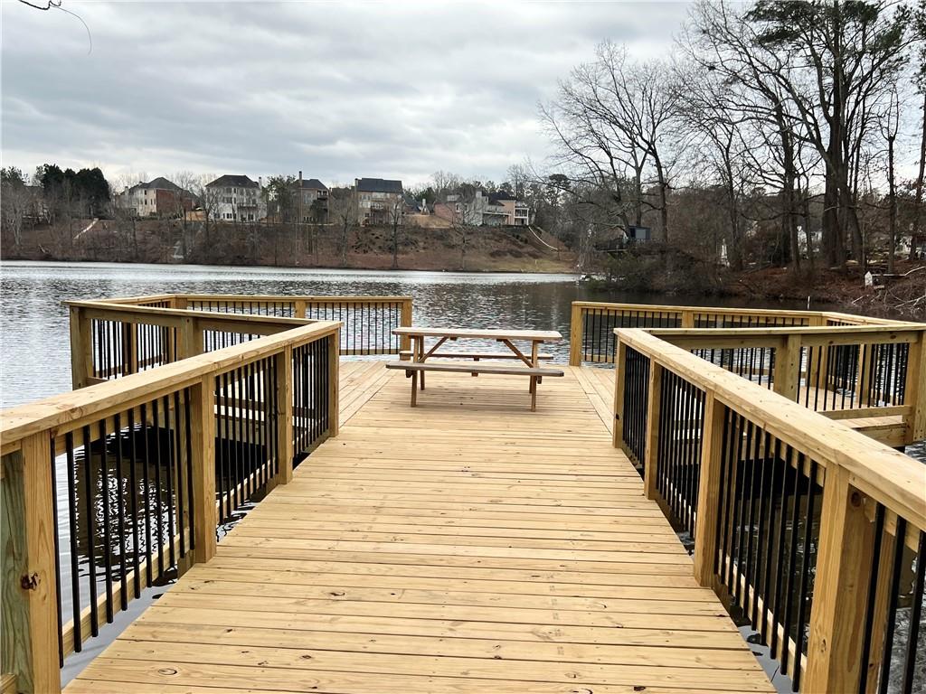 5415 Taylor Road Alpharetta, GA 30022 - Photo 28 of 29 a view of wooden deck with a lake