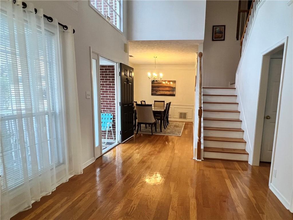 5415 Taylor Road Alpharetta, GA 30022 - Photo 5 of 29 a view of a room with wooden floor and stairs