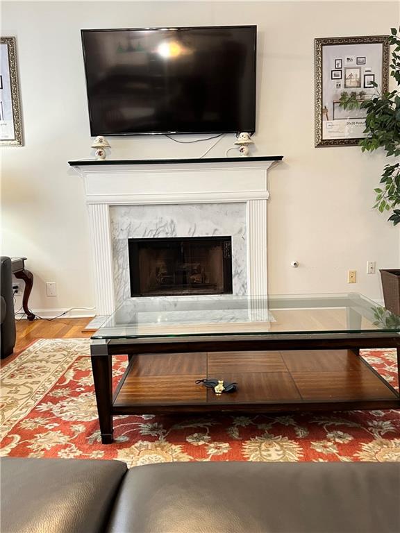 5415 Taylor Road Alpharetta, GA 30022 - Photo 10 of 29 a living room with a fireplace and a flat screen tv