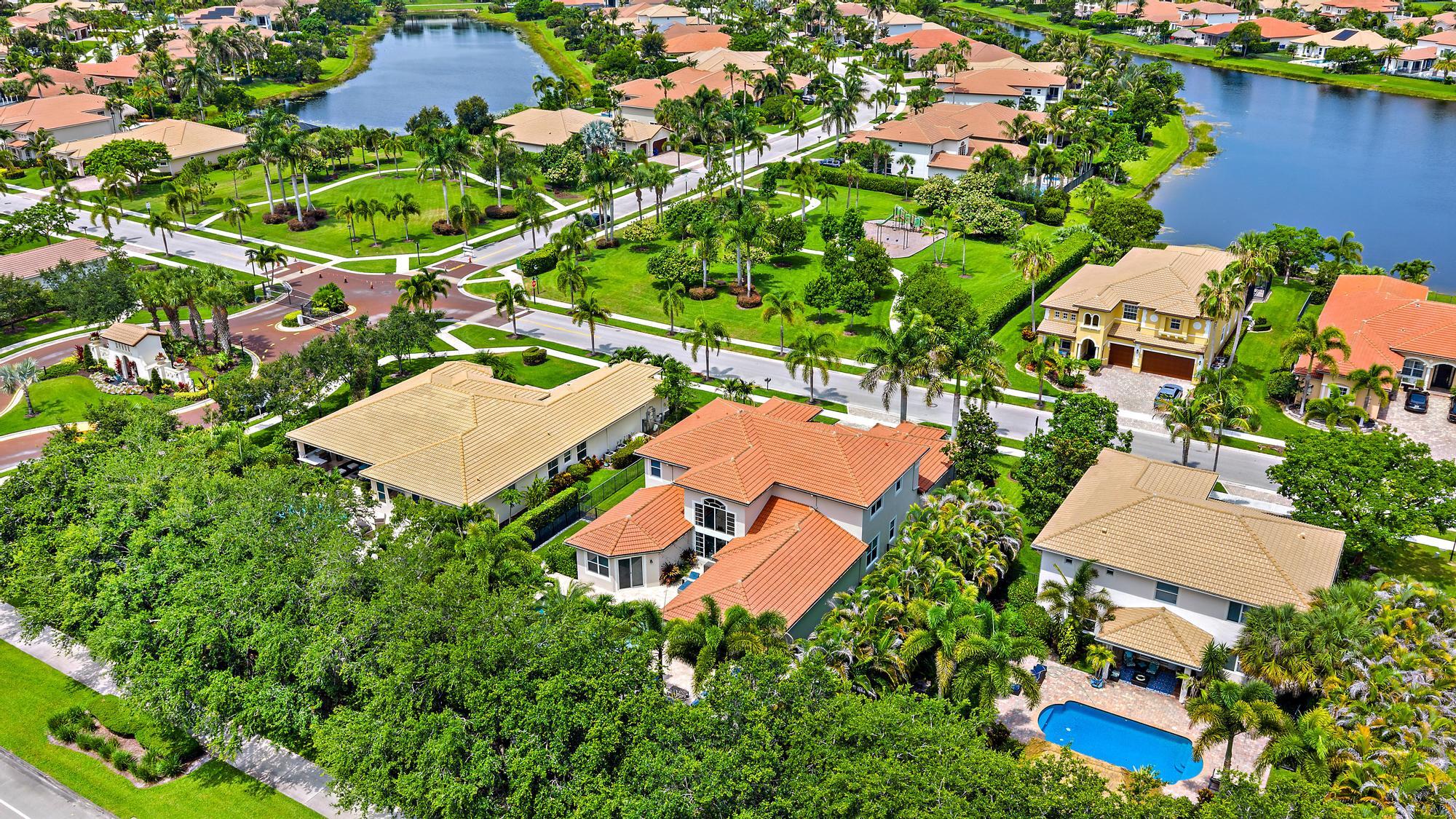 283 Rudder Cay Way Jupiter, FL 33458 - Photo 27 of 41 an aerial view of a house with a yard and lake view