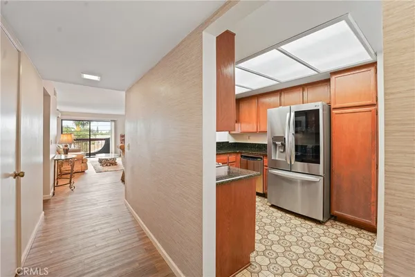 a view of a kitchen from the hallway