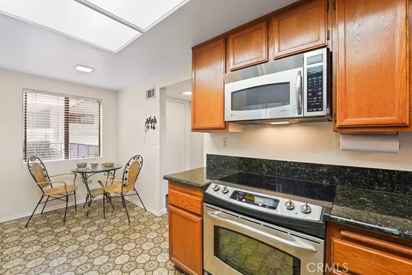 a kitchen with a stove and a microwave