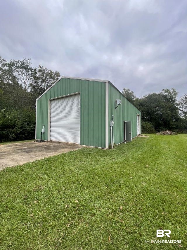 26128 County Road 49 Loxley, AL 36551 - Photo 4 of 6 Detached garage featuring driveway
