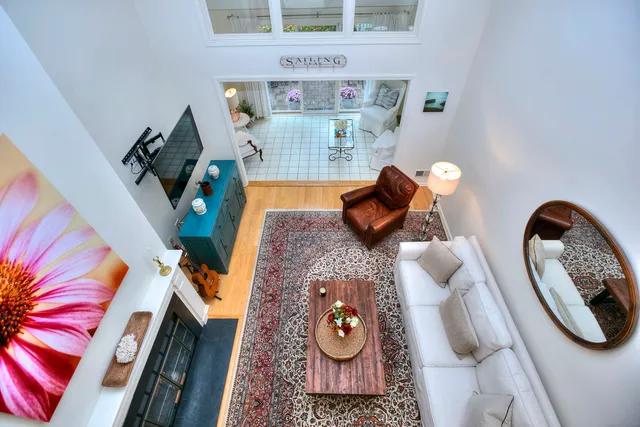 a view of living room with furniture and a rug