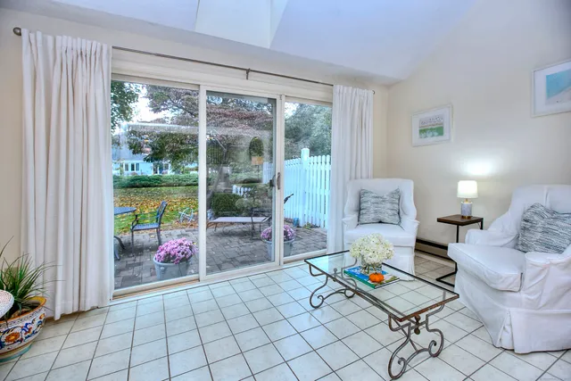 a living room filled with furniture and a table