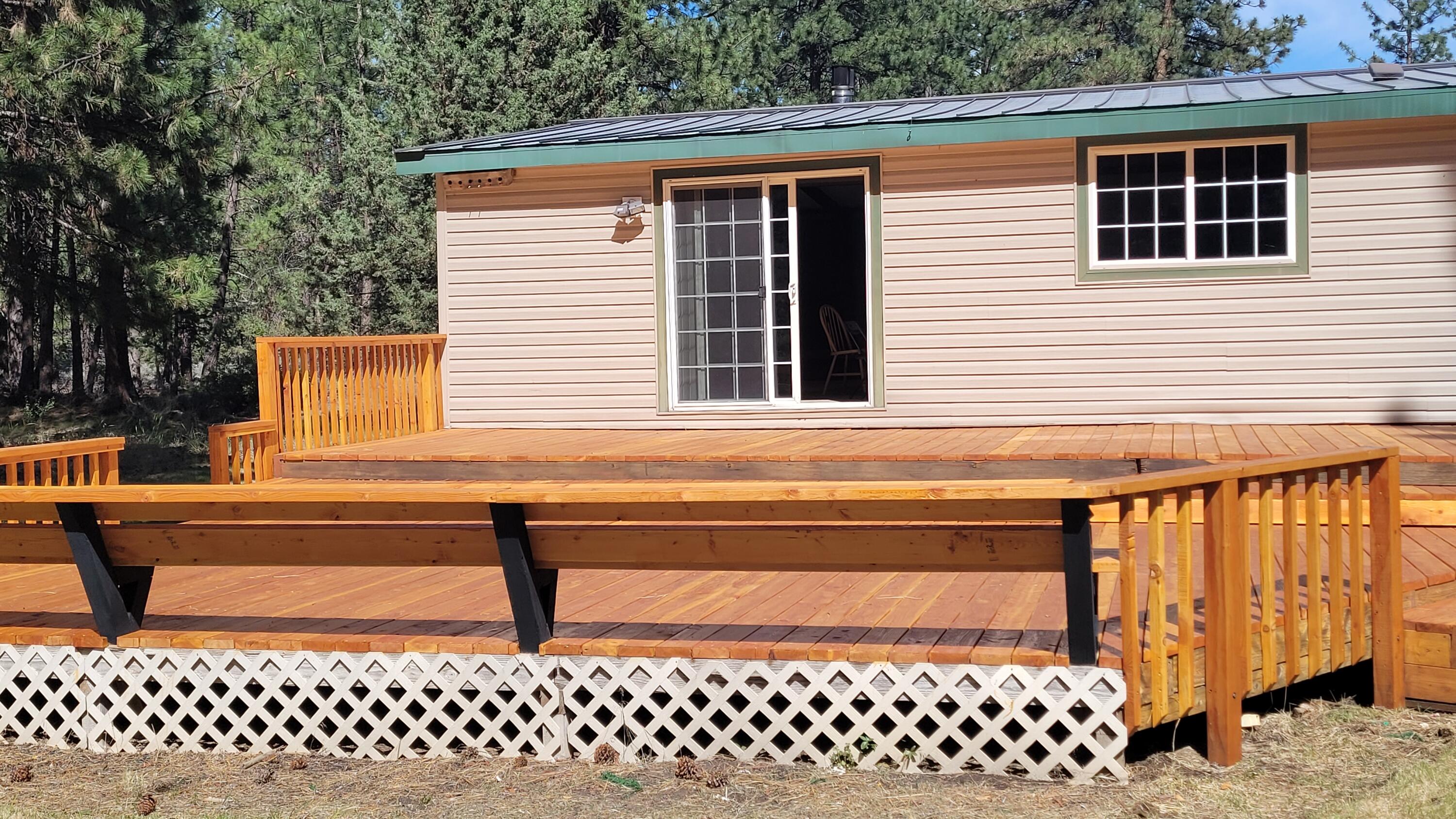 19724 Buck Canyon Road Bend, OR 97702 - Photo 20 of 38 Deck has a long built in bench.