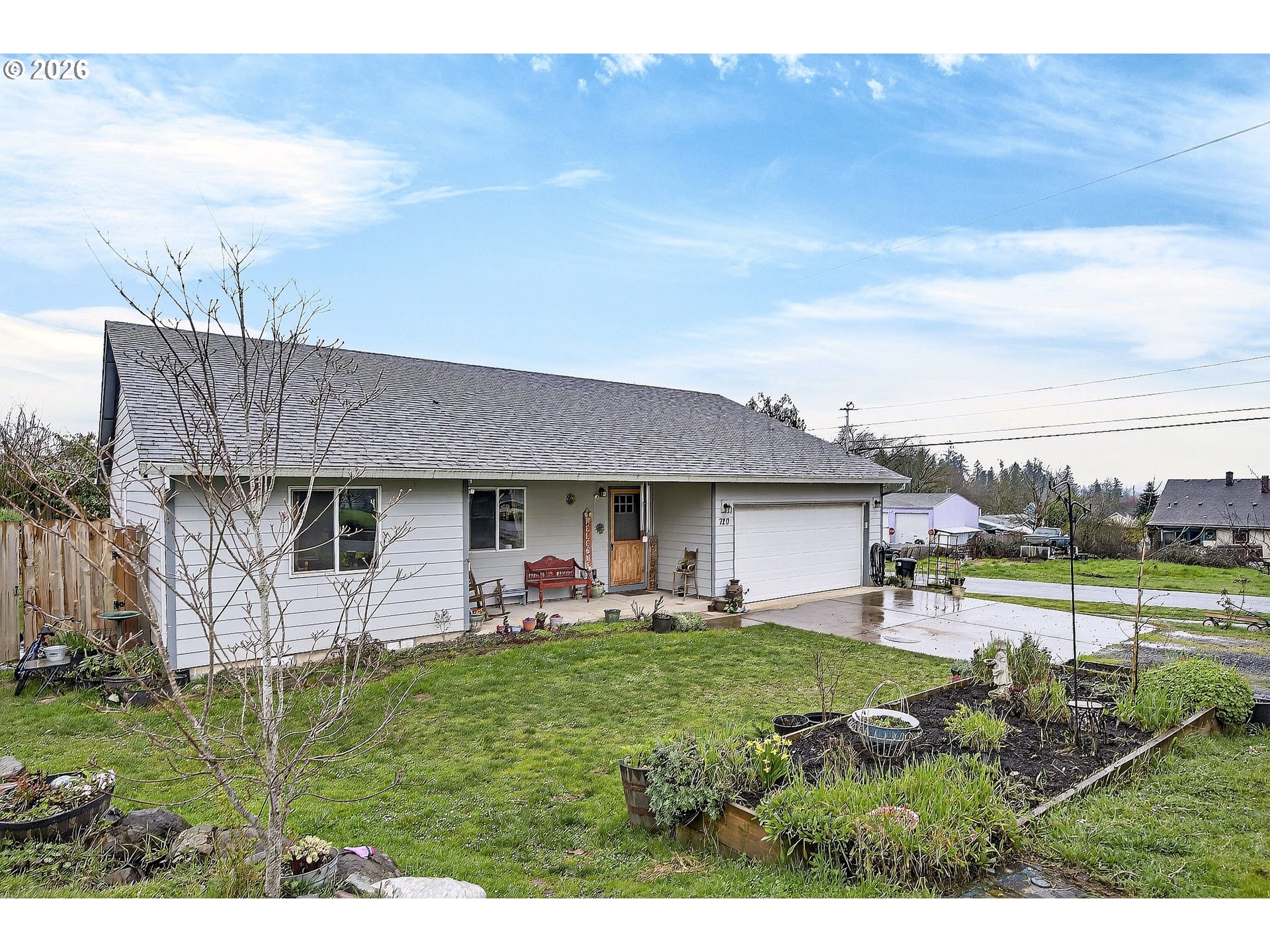 a view of a house with a yard and sitting area