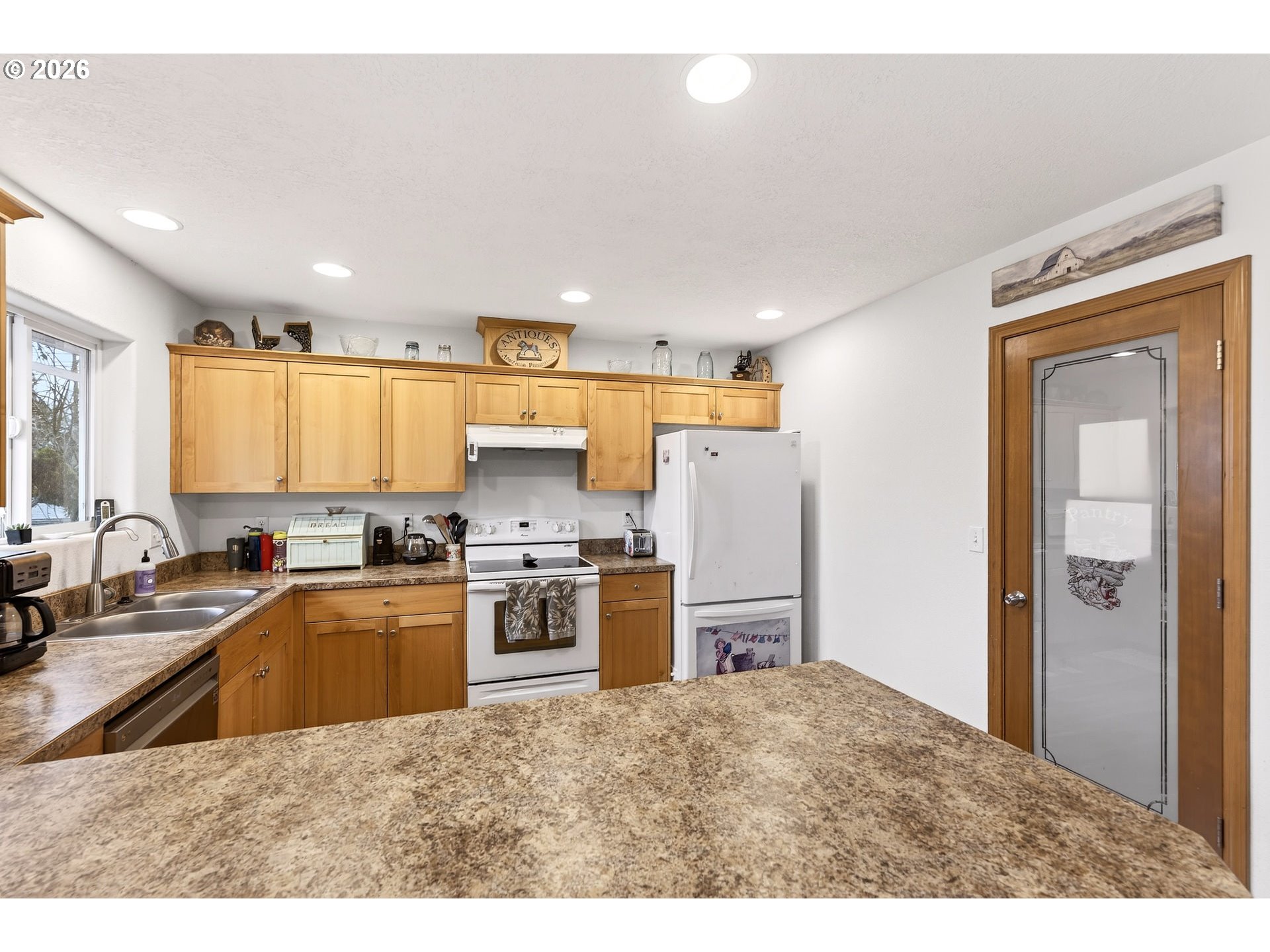 720 Market Street Lafayette, OR 97127 - Photo 12 of 35 a kitchen with a refrigerator and a sink