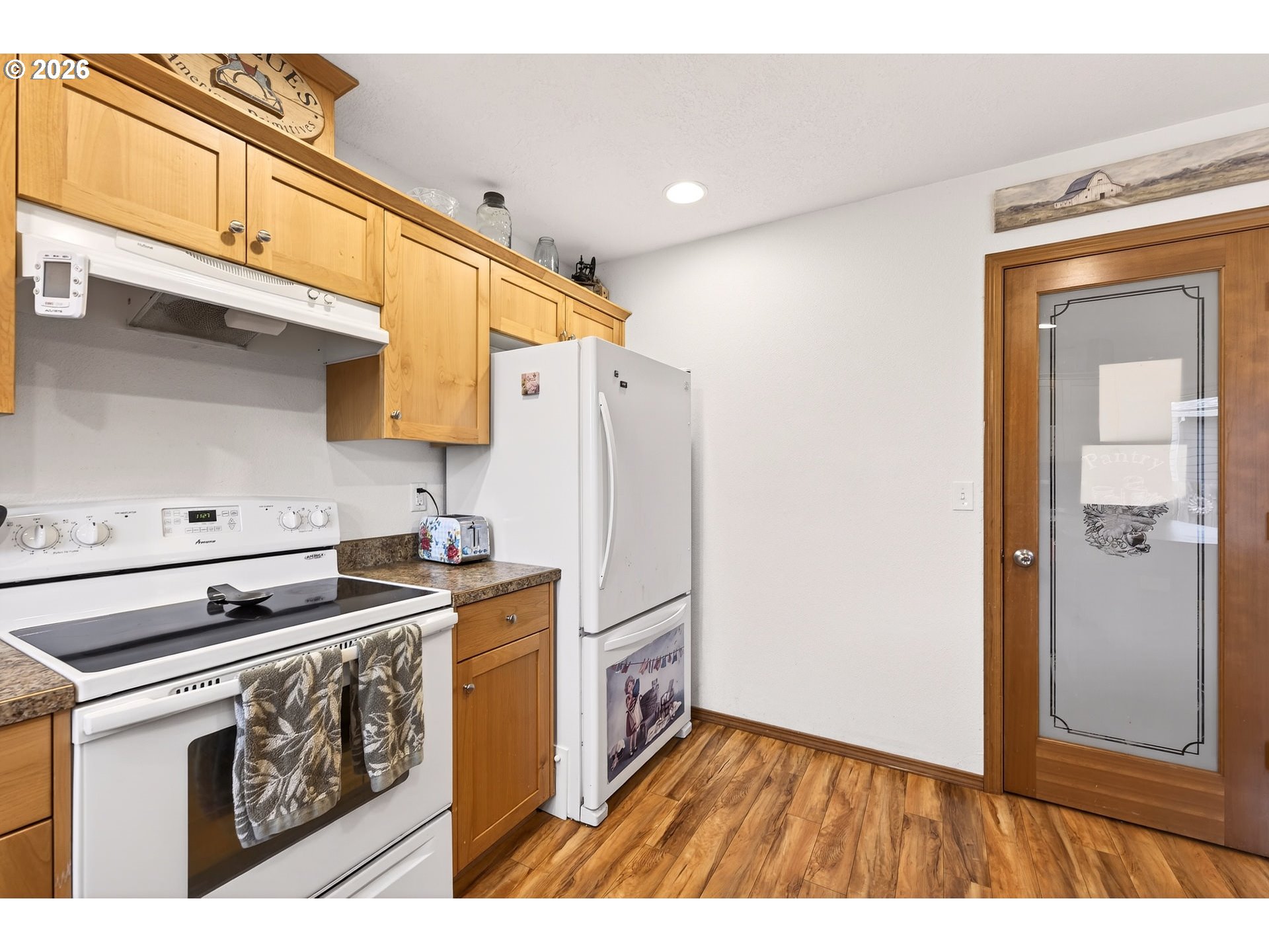 720 Market Street Lafayette, OR 97127 - Photo 13 of 35 a kitchen with a stove a refrigerator and a sink