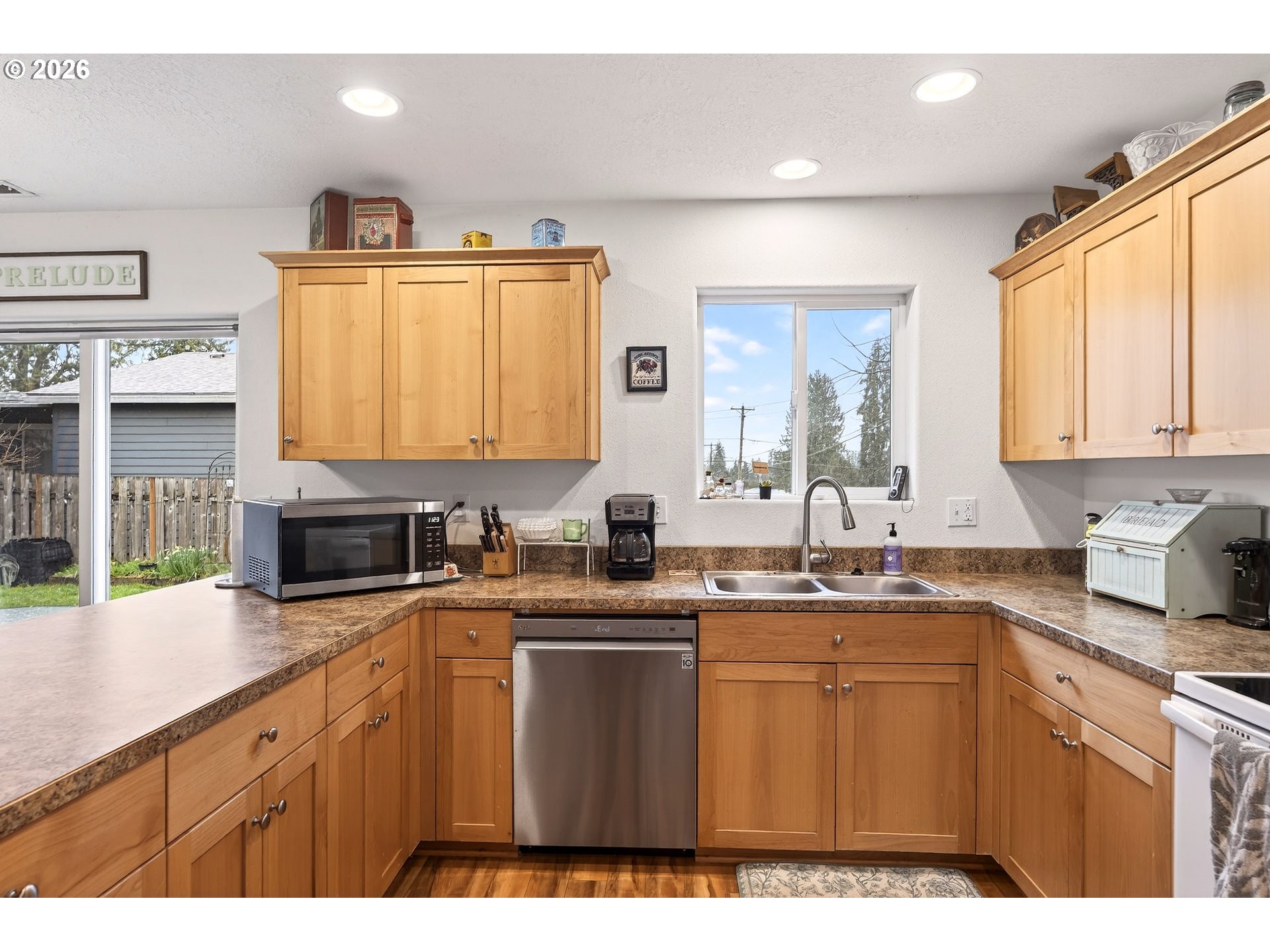 720 Market Street Lafayette, OR 97127 - Photo 14 of 35 a kitchen with stainless steel appliances a sink stove and cabinets