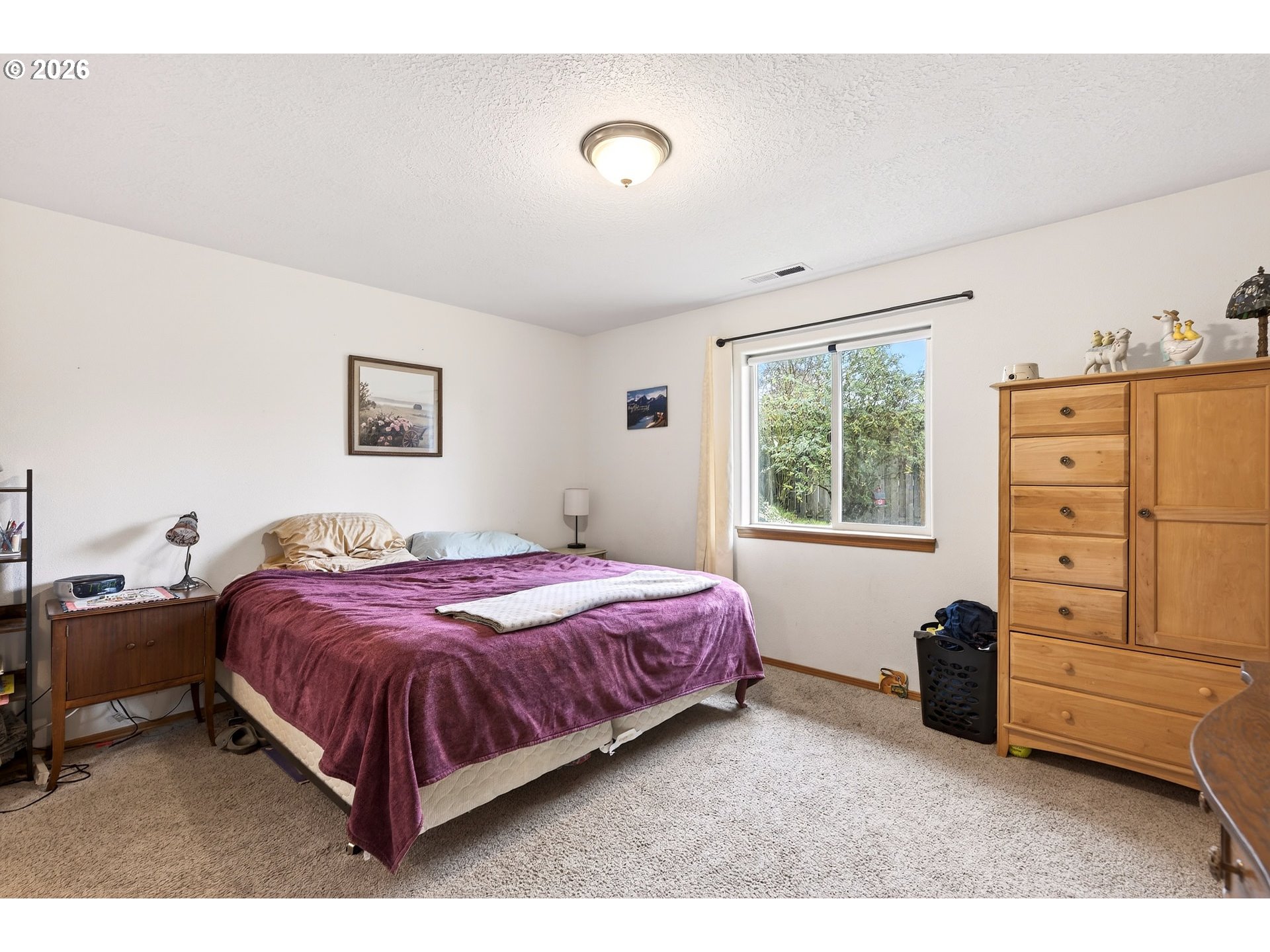 720 Market Street Lafayette, OR 97127 - Photo 16 of 35 a bedroom with a bed and a tv