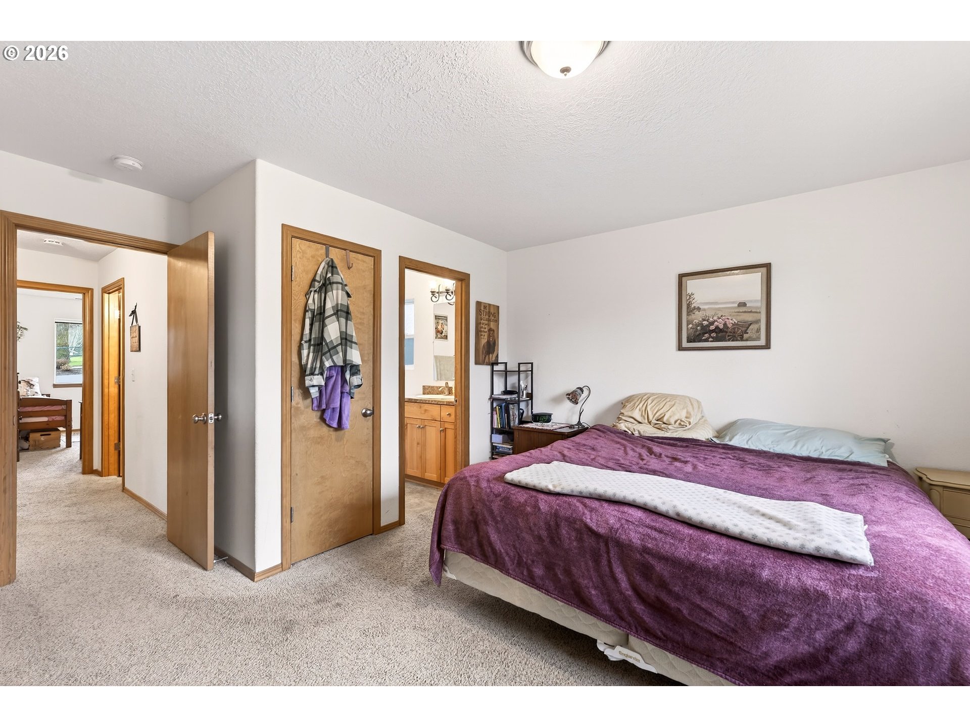 720 Market Street Lafayette, OR 97127 - Photo 17 of 35 a bedroom with a bed and a painting