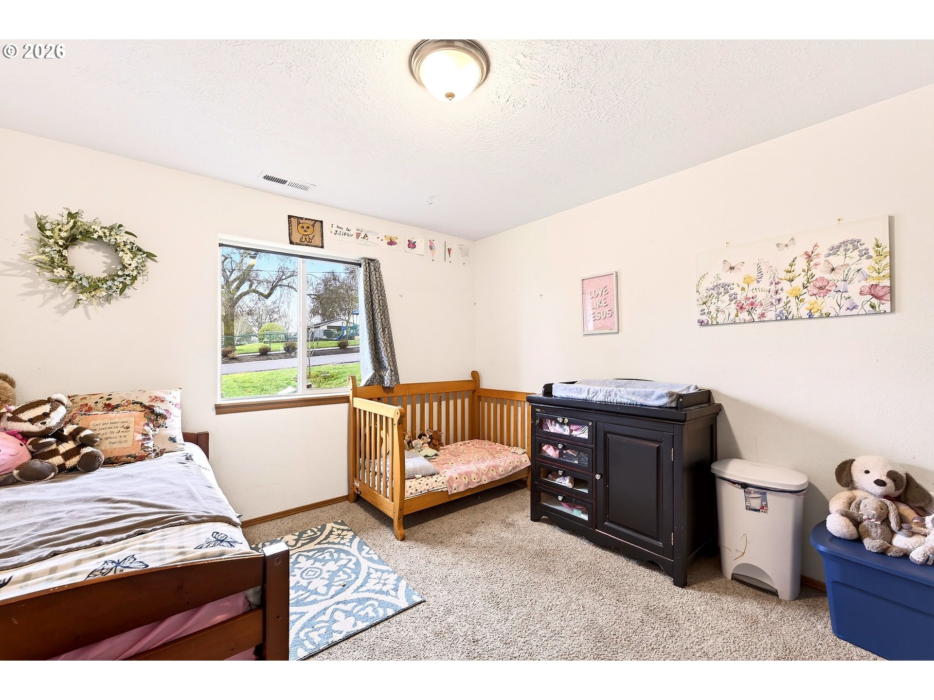 720 Market Street Lafayette, OR 97127 - Photo 21 of 35 a bedroom with furniture and a window