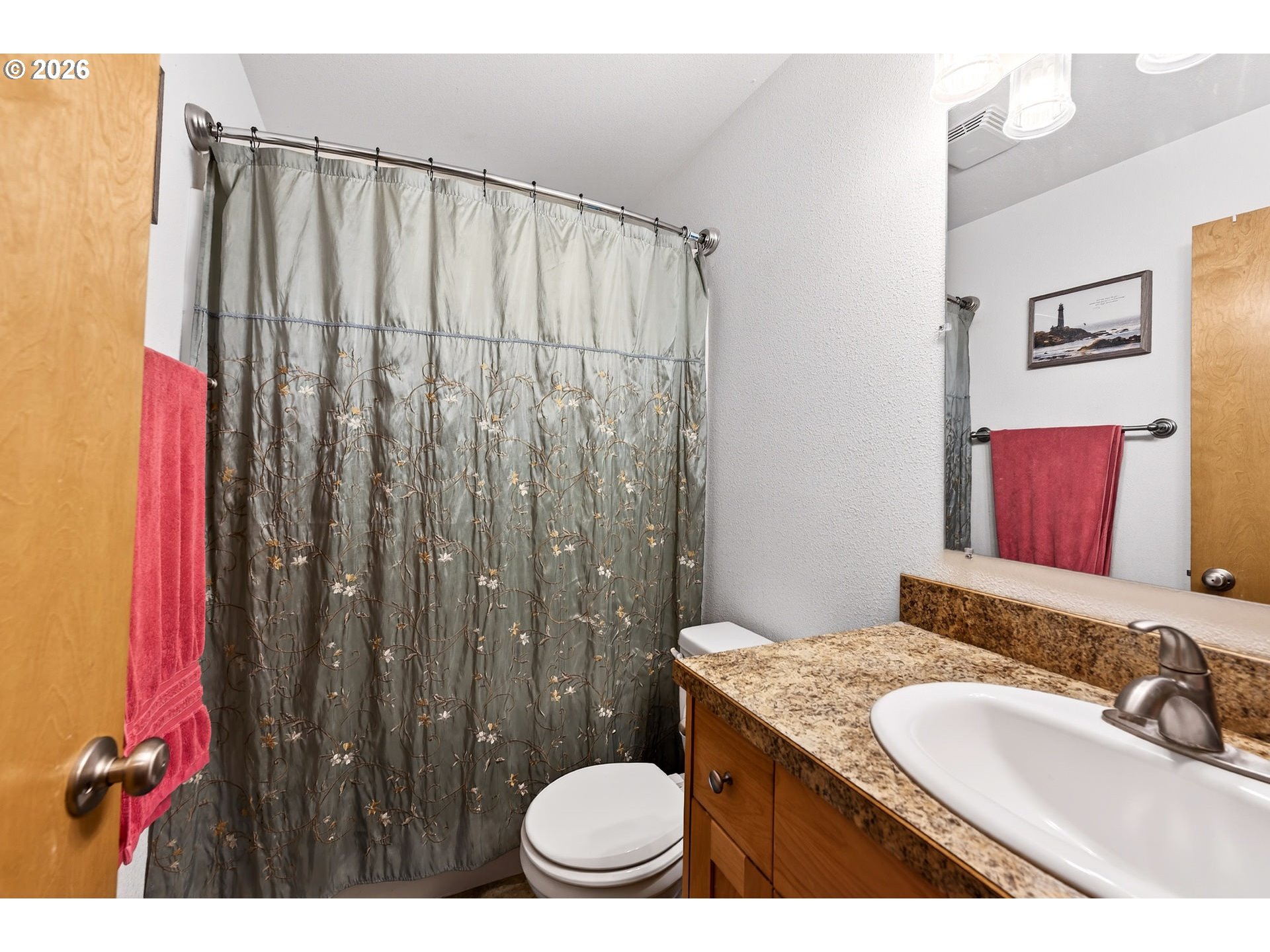 720 Market Street Lafayette, OR 97127 - Photo 23 of 35 a bathroom with a granite countertop sink a toilet and shower