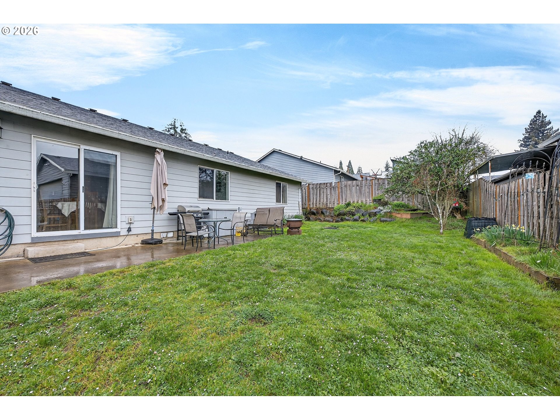 720 Market Street Lafayette, OR 97127 - Photo 4 of 35 a backyard of a house with table and chairs