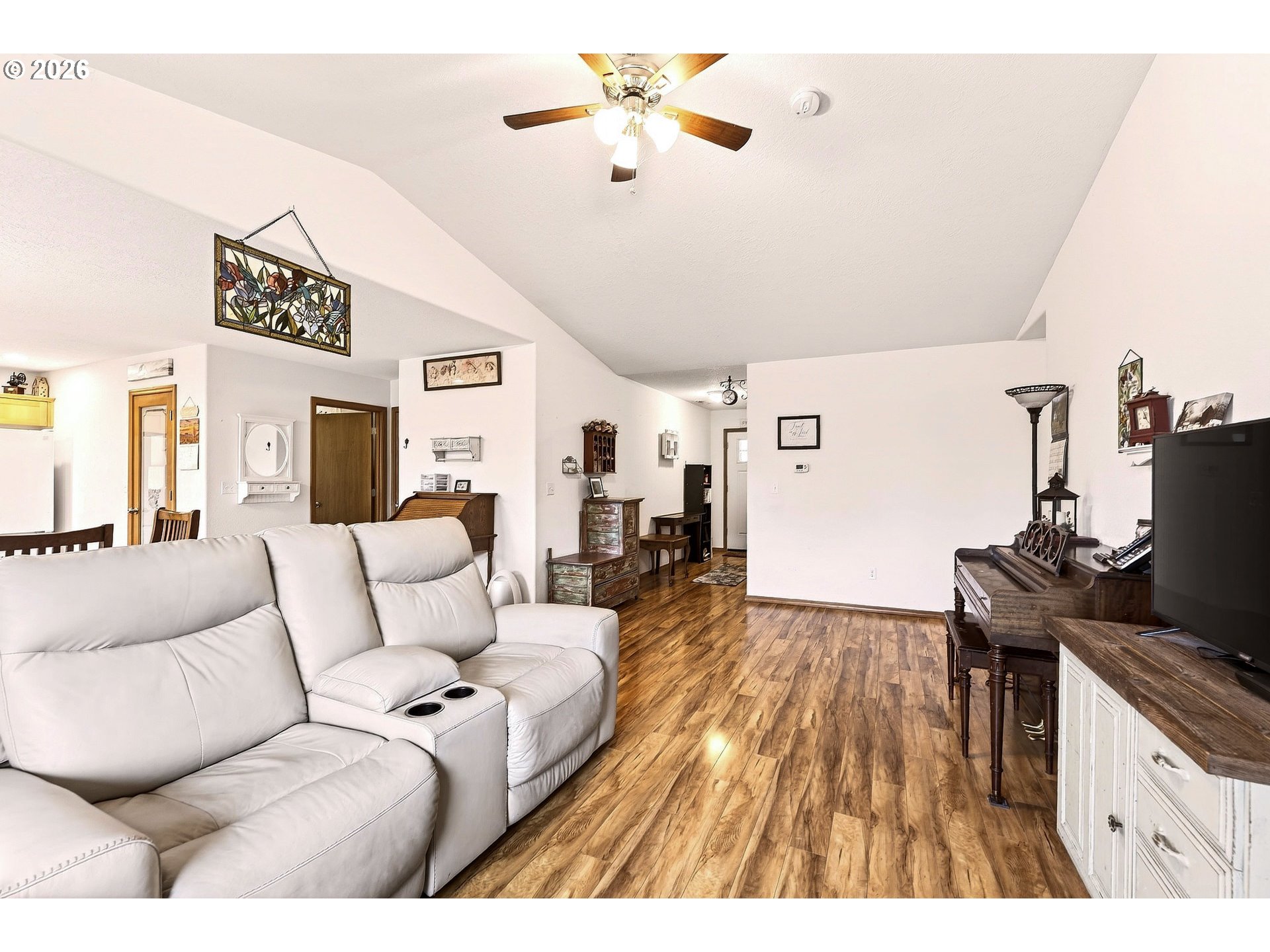 720 Market Street Lafayette, OR 97127 - Photo 6 of 35 a living room with furniture and a flat screen tv