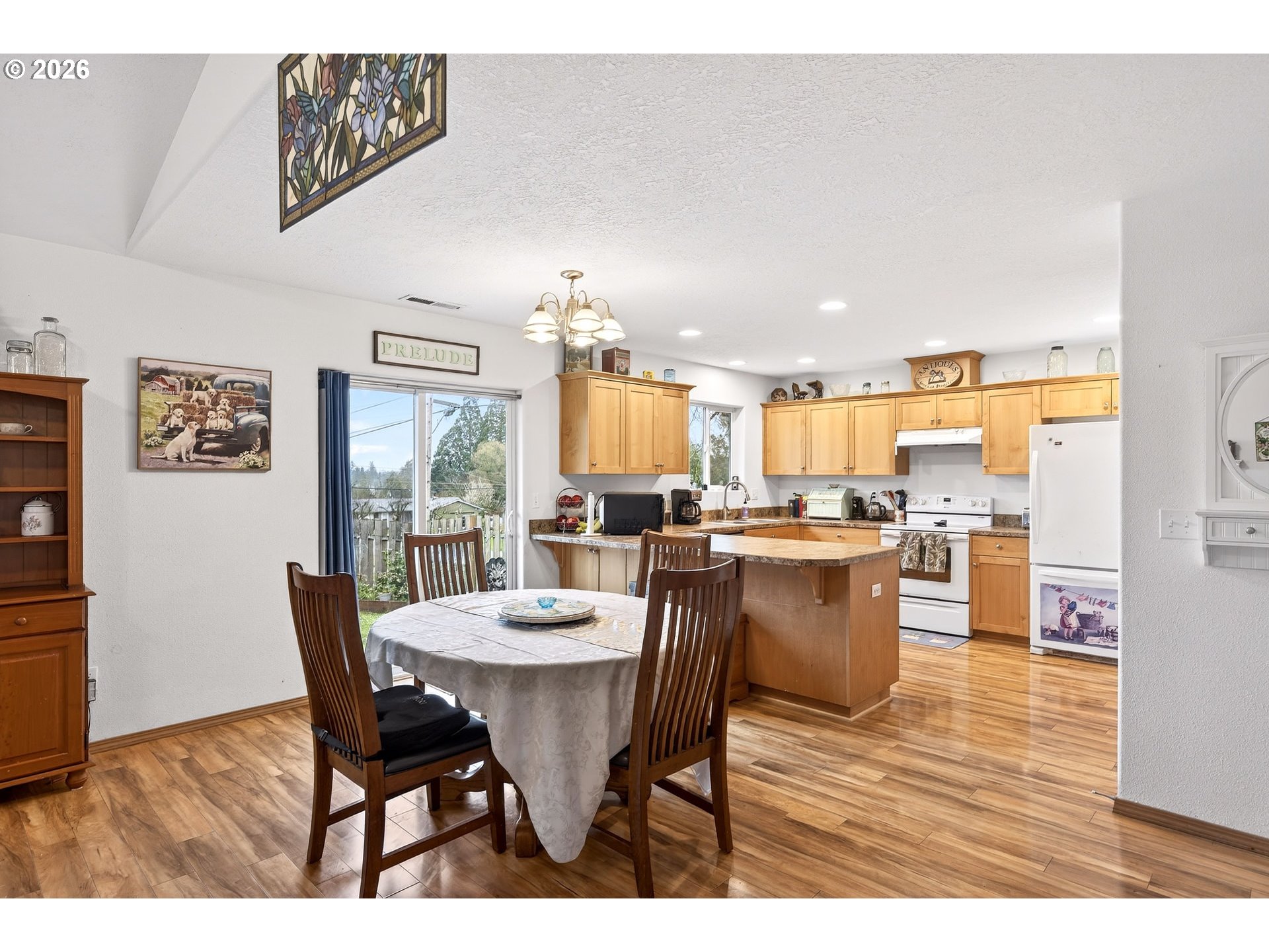 720 Market Street Lafayette, OR 97127 - Photo 10 of 35 a view of a dining room with furniture and wooden floor