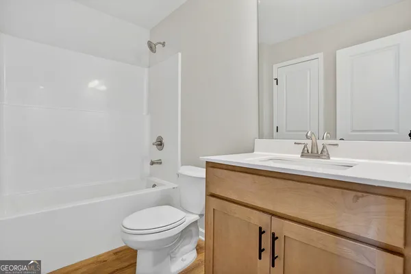 a large kitchen with kitchen island a large window a sink and a counter space