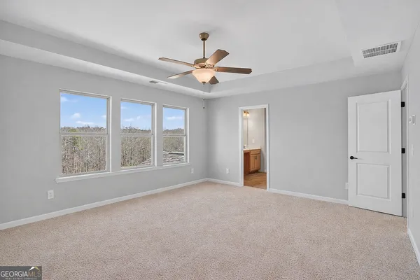 a view of a backyard of a garage