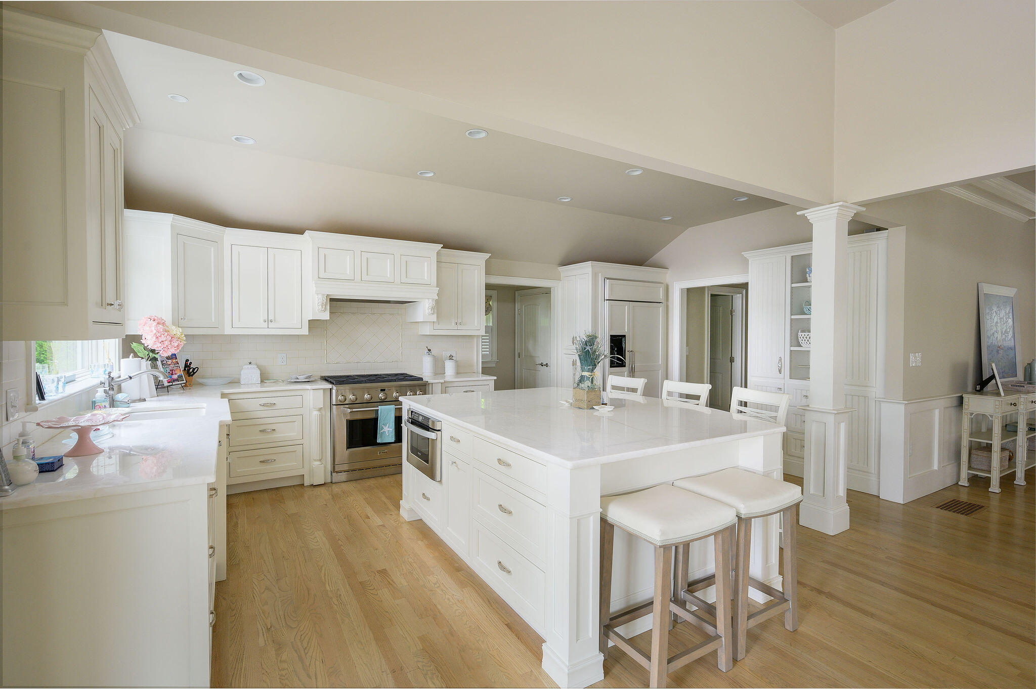 256 Holly Point Road Centerville, MA 02632 - Photo 23 of 53 a kitchen with a sink stove cabinets and wooden floor