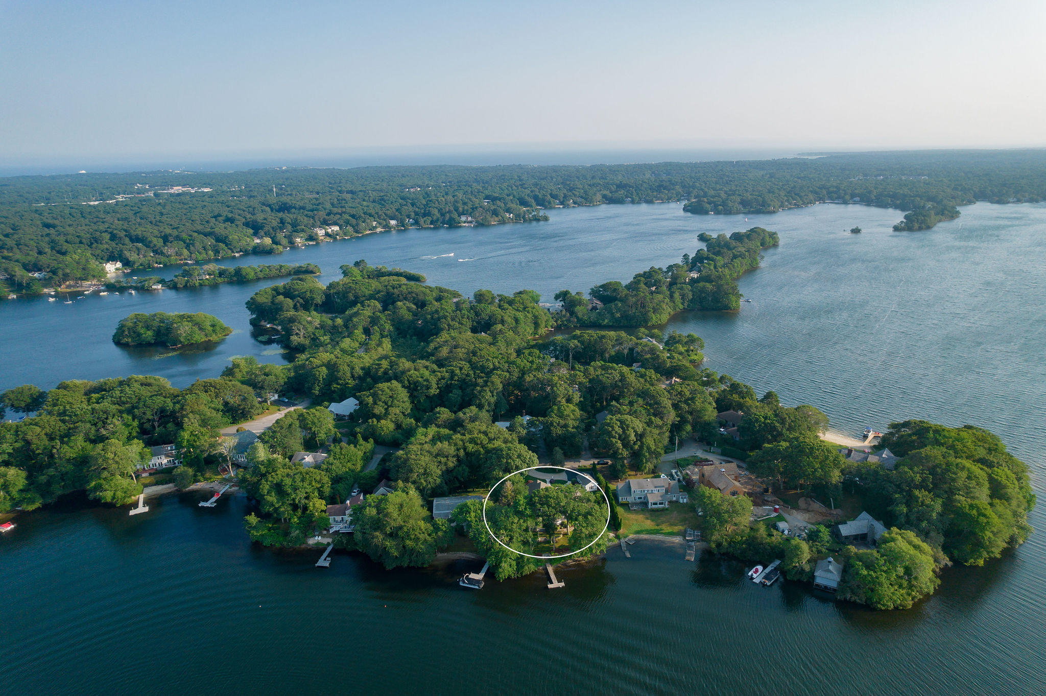 256 Holly Point Road Centerville, MA 02632 - Photo 44 of 53 an aerial view of a house with outdoor space and lake view