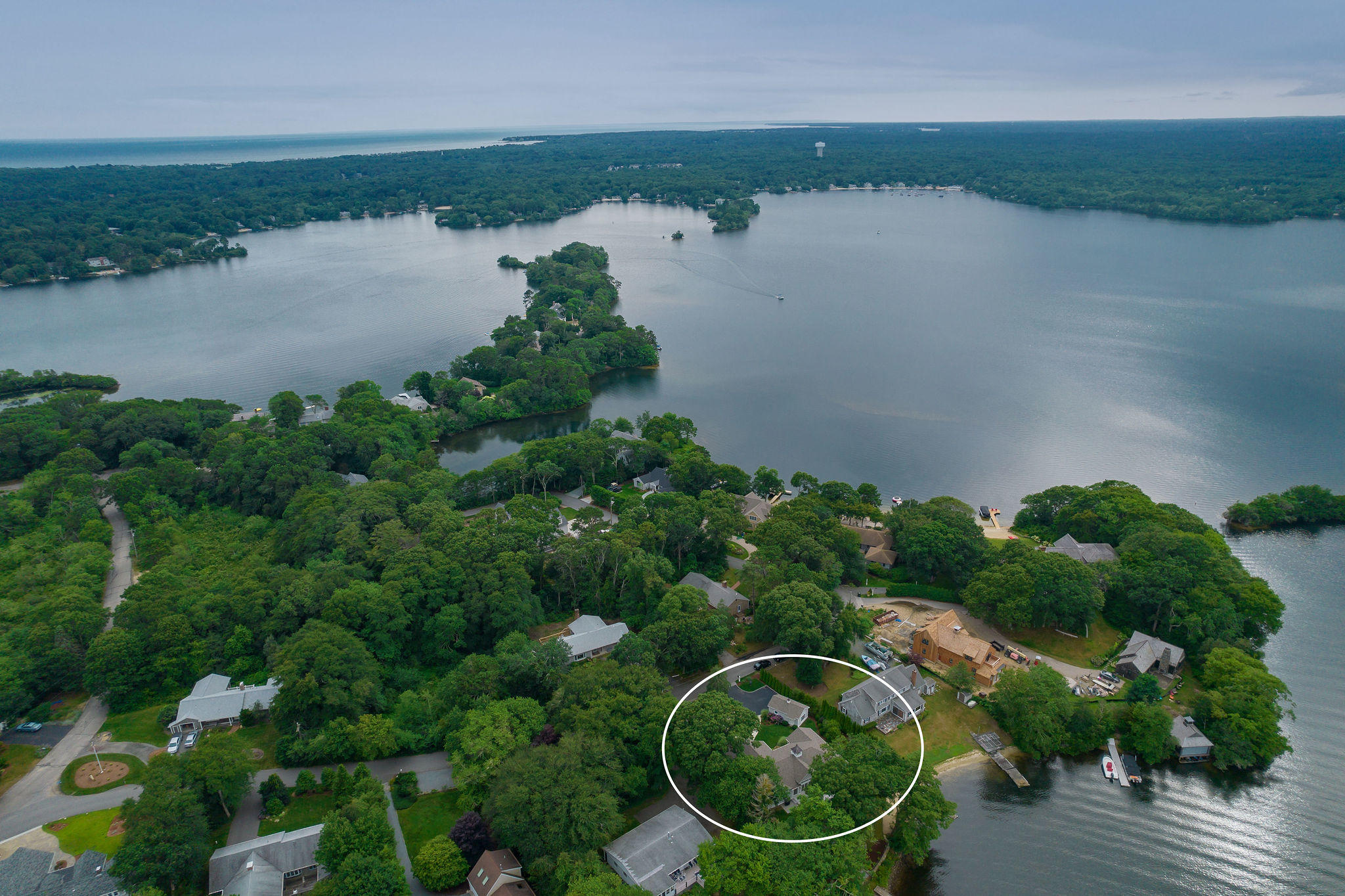 256 Holly Point Road Centerville, MA 02632 - Photo 50 of 53 an aerial view of lake and residential houses with outdoor space
