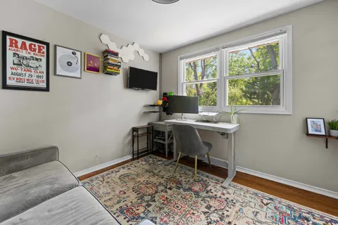 a workspace with furniture and window