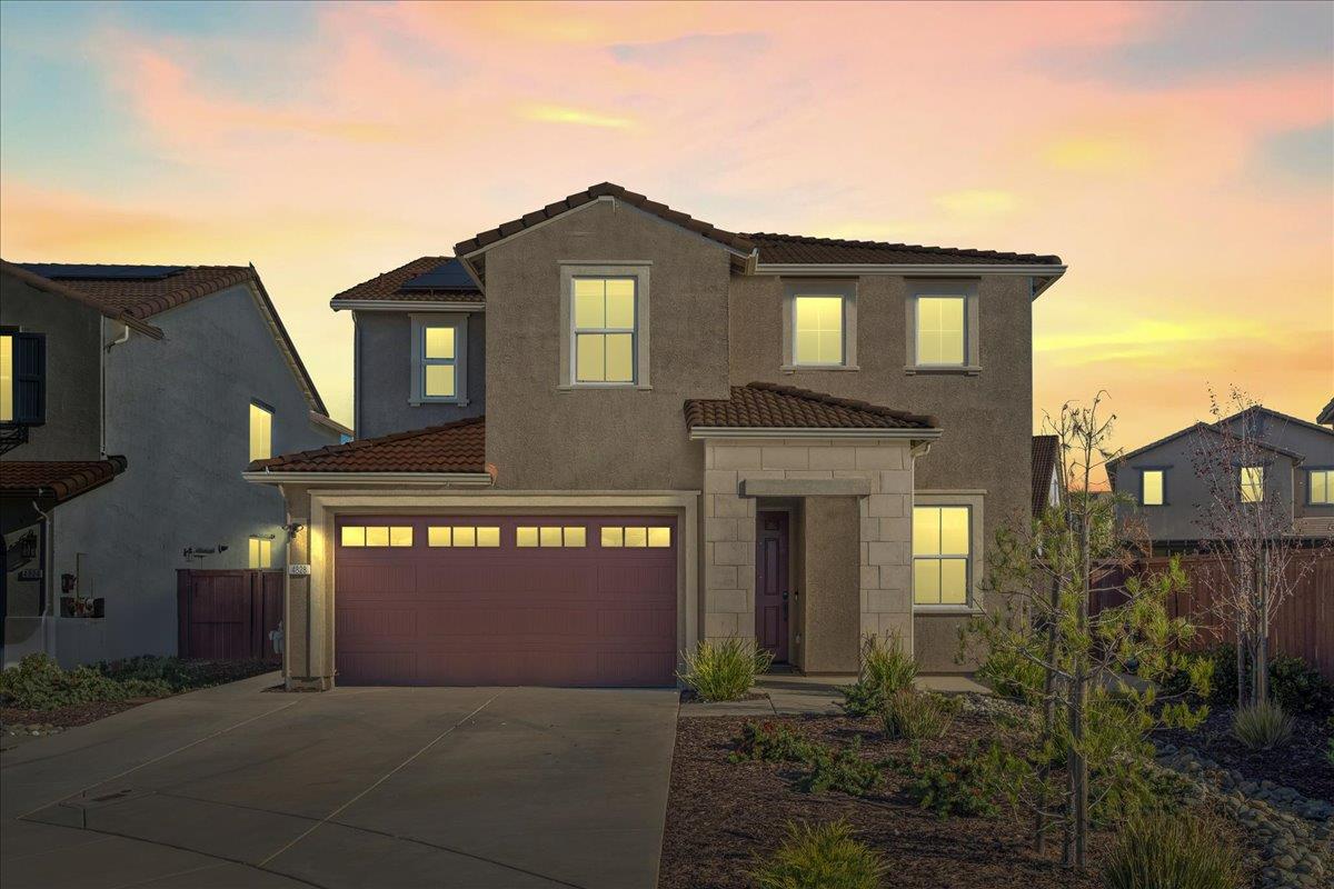 4828 Aldridge Ravine Court Folsom, CA 95630 - Photo 1 of 43 a front view of a house with yard and parking