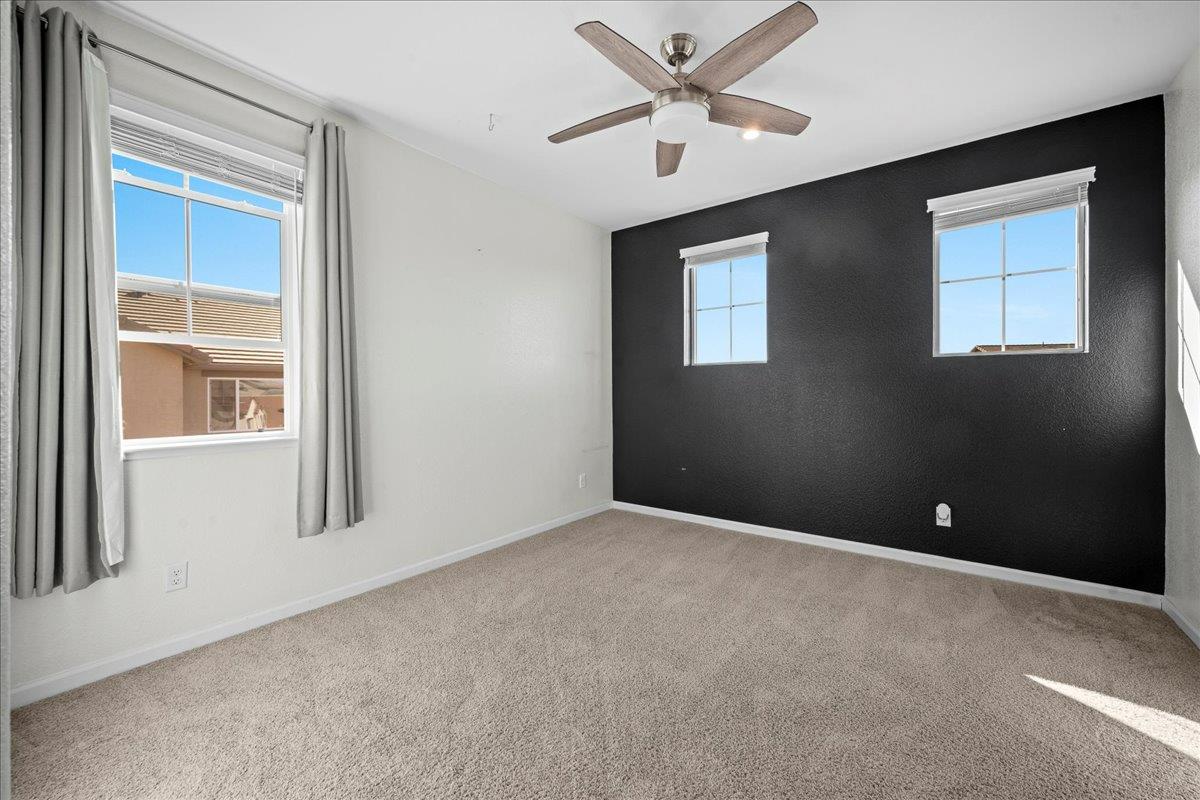 4828 Aldridge Ravine Court Folsom, CA 95630 - Photo 26 of 43 an empty room with windows and fan