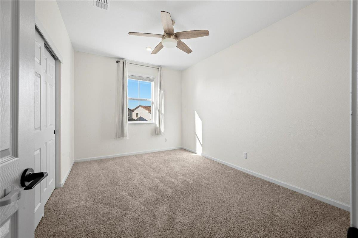 4828 Aldridge Ravine Court Folsom, CA 95630 - Photo 27 of 43 an empty room with closet and windows
