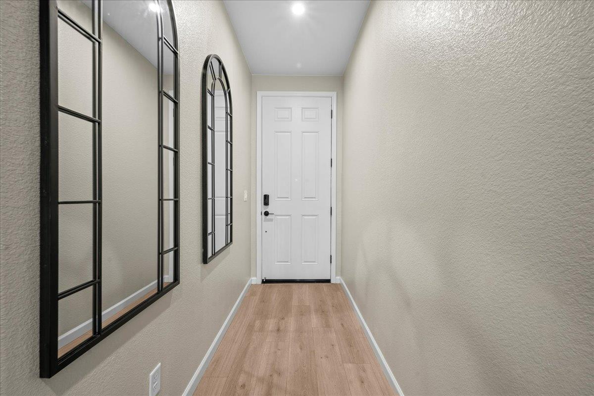 4828 Aldridge Ravine Court Folsom, CA 95630 - Photo 3 of 43 a view of a hallway with wooden floor