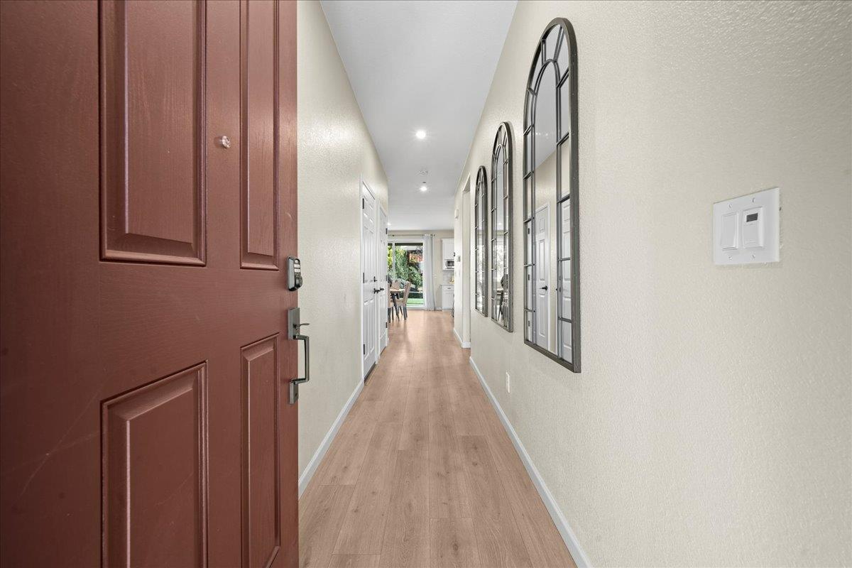 4828 Aldridge Ravine Court Folsom, CA 95630 - Photo 4 of 43 a view of a hallway with wooden floor