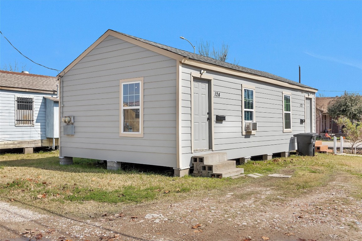 5817 Downing Street Houston, TX 77020 - Photo 7 of 10 a view of a house with a yard