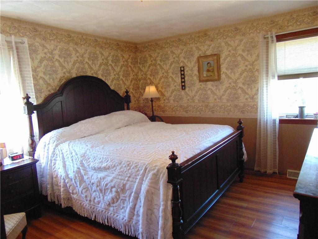 361 Adelaide Road Connellsville, PA 15425 - Photo 15 of 35 a bed sitting in a bedroom next to a window