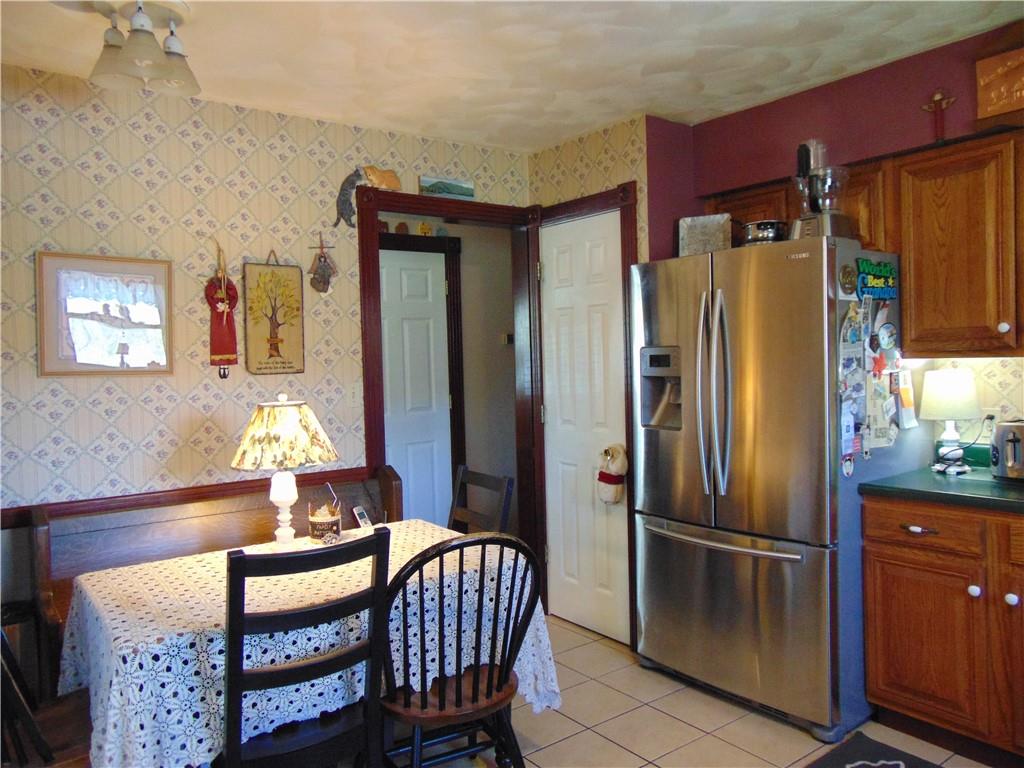 361 Adelaide Road Connellsville, PA 15425 - Photo 5 of 35 a kitchen with stainless steel appliances granite countertop a refrigerator and a dining table