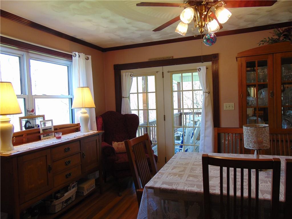 361 Adelaide Road Connellsville, PA 15425 - Photo 9 of 35 a view of a dining room with furniture a chandelier and wooden floor