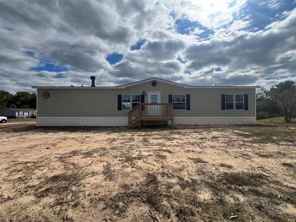 a front view of house with yard
