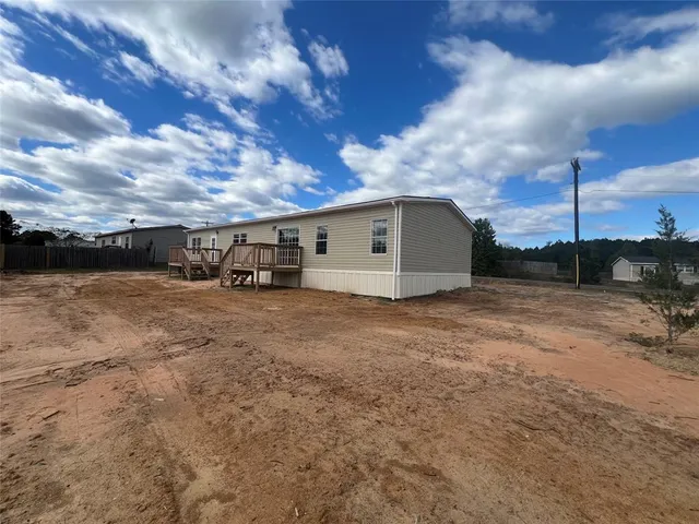 a view of a car in front of a house