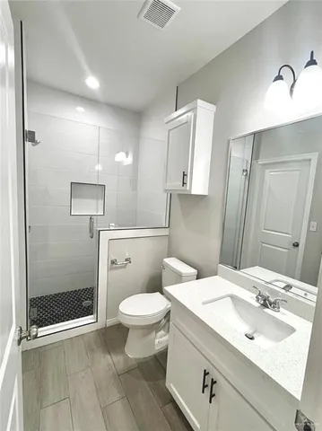 a bathroom with a toilet bathtub and shower