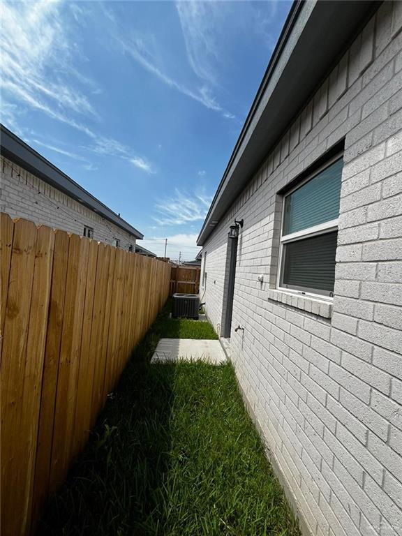 1635 Playa Drive, Unit 2 Weslaco, TX 78596 - Photo 4 of 17 a house view with a backyard space