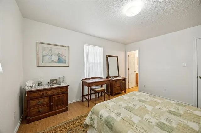 a bedroom with a bed and a table in it